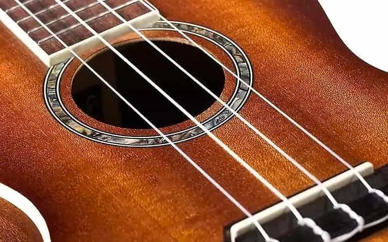 Cordoba 15CM concert ukulele soundhole and bridge closeup copy