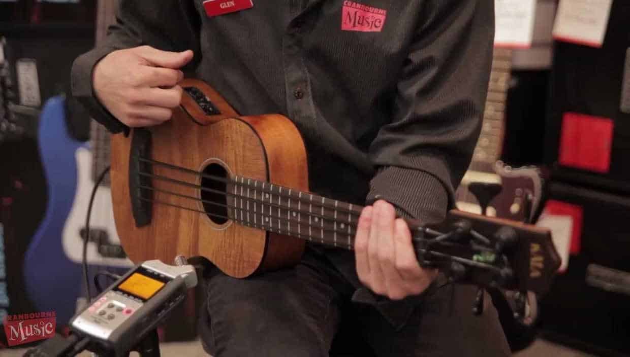 Kala Exotic Mahogany U-Bass with Player at Show